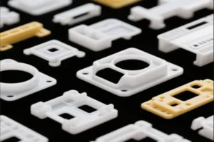 Close-up of various white and yellow plastic components, showcasing precision molding and detailed design.