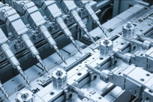Multi-spindle CNC drilling and milling machine with synchronized cutting tools on an automated metal parts production line.