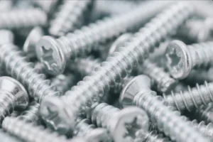 Close-up of zinc-plated Torx screws in bulk, showing clean threads and consistent finish for industrial fastener supply.