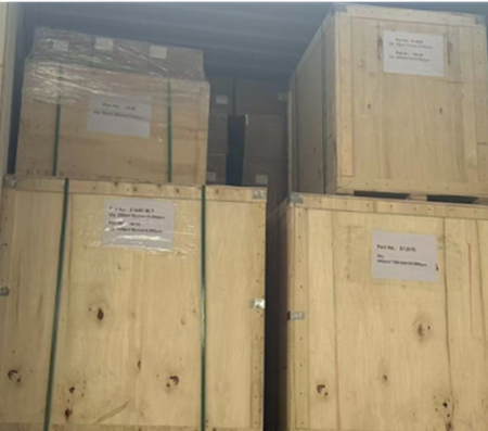 Export wooden crates packed and labeled for shipment, showing secure packaging for OEM custom parts and international delivery.