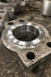 Forged metal parts for oil and gas equipment with machined sealing faces